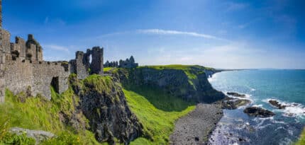 Views of Dunluce Castle and the white cliffs and Whiterocks near Portrush on the County Antrim Coast.