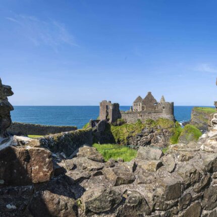 Views of Dunluce Castle and the white cliffs and Whiterocks near Portrush on the County Antrim Coast.